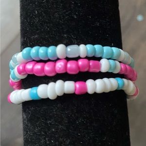 Bracelet set of three blue and pink themed.
